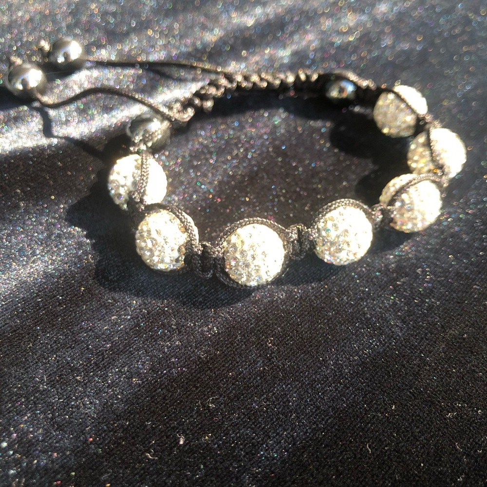 White crystal bracelet with black cord band